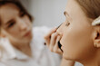 © Stanislav - Make-up artist at work. Applying make-up to model face.