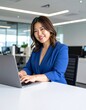 © 貴宏 西山 - Japanese curvy woman in office attire with open neckline, working on laptop, looking