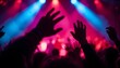 © Ghulam - Silhouettes of Hands at Concert with Dramatic Stage Lighting