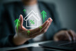 © bixpicture - Housing market, real estate trend and loan interest concept. Real estate interest rates increasing, floating house icon with percentage signs and green upward arrows on businessperson's hand.