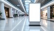 © Citra - Blank vertical light box advertising mockup standing in a modern shopping mall corridor. Empty digital billboard for commercial display