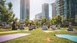 © Maria - Diverse meditation group practicing yoga in lotus pose, green urban park setting with skyscrapers towering behind tranquil practitioners