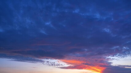 Wall Mural - A sunrise sky timelapse symbolizes renewal, as golden light breaks through clouds. It reflects hope, transformation, balance, resilience, and the endless cycle of beginnings that inspire growth.
