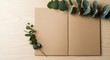 © Kinton - Eucalyptus branches decorate neutral presentation boards on wood surface