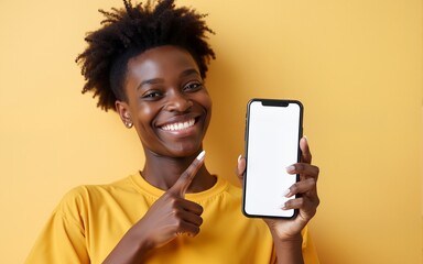 Happy African American teen student holding mobile cell phone pointing finger at smartphone mock up big screen template presenting application, using cellphone showing ad isolated on beige background.