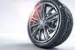 © idharmaian - Close-up of a car wheel.  Dark gray alloy rim,  tire tread visible.  Soft,  light background