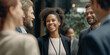 © NafiliaEmil - A diverse group of business people engaging in a friendly conversation in an office hallway. The image capture a positive and collaborative work environment with multicultural colleagues. High quality