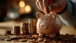 © netsay - A Vibrant Scene of Determination Closeup Shot of a Hand Adding Coins to a Piggy Bank Perfect for Financial and Inspiration Projects, Boosting Drive and Encouraging Saving Habits.