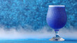 © S.W. - Blue glitter drink in glass with Halloween decor background creating festive mood and magical atmosphere