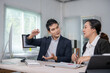 © Apichat - Business people discussing work in office meeting room