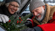© syhin_stas - people laughing while loading Christmas tree into SUV trunk, cozy winter clothing, happy holiday preparation