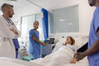 © ReeldealHD images - Doctor and Nurses Assess Patient's Condition