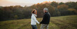 © Halfpoint - Senior couple walking hand by hand in autumn sunset light.