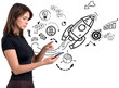 © ImageFlow - Woman holding and using smartphone, surrounded by startup and business icon doodles, isolated on white background, symbolizing modern innovation