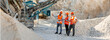 © Maria Vitkovska - Engineers inspecting rock crushing machine in quarry