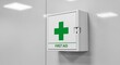 © Dom - White First Aid Kit Box Mounted on a Light Gray Wall.