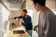 © Davor - Men Cleaning Kitchen Together