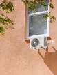 © Igor Morozov/Stocksy - Air conditioning on the outside wall of the house