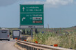 Road transportation on Sicily, Italy, green signs guide to cities by highways, blue signs by city roads. Arrows, distances, and exits help travelers navigate Sicily