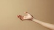 © Naknakhone - An outstretched hand against a neutral background, symbolizing offering, connection, or greeting.