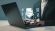 © Prosenjit - Digital Finance Interface: A business professional navigates the realm of digital finance, interacting with holographic icons of invoice, and financial data on a sleek laptop.