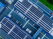 © Yic Ma/Stocksy - Aerial View of Factory with Solar Panels and Transport Trucks