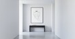 © DisignUA - Minimalist ghost illustration in a black frame hanging above a console table in a modern white hallway with concrete floor.