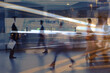 © kieferpix - business people crowd walking commuting in the city, lights and motion blur abstract