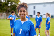 © Rido - Portrait of african girl athlete smiling at soccer field