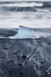 © robertharding - Iceberg or Growler shaped like a Glass Slipper on Fellsfjara Beach, nicknamed Diamond Beach, near Jokulsarlon, Southern Iceland, Europe