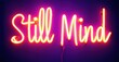 © antishock - Bright neon sign displays text Still Mind. Vivid orange glows against deep purple backdrop. Minimalist design, modern aesthetic.