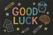 © Vladyslav Tykhonov - Good luck is written on a black chalkboard with various drawings of school supplies and a clock. The chalkboard is decorated with stars and a brain, giving it a playful and positive vibe