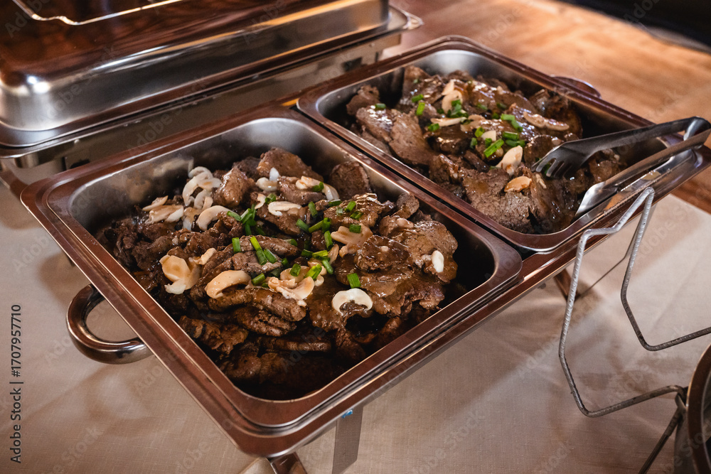 meat on a buffet table, roast meat, Brazilian party food, pan meat in ...