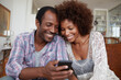 © Pixel Pantry - A couple watching a video on the phone