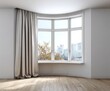 © YOUR - Empty room with a bay window featuring light beige curtains, showcasing a view of a city skyline.