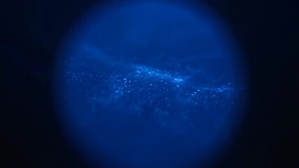 Wall Mural - A seamlessly looping video displays a dark blue shimmering circular flare with a slow wave effect, creating an abstract deep ocean light dreamy, technology, digital