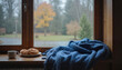 © Sitari - Cozy window sill with warm blankets, coffee, and autumn scenery