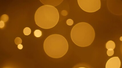 Wall Mural - Abstract golden bokeh spheres gently floating and pulsating, creating a mesmerizing, seamlessly looping light background pulsating, happy, light background