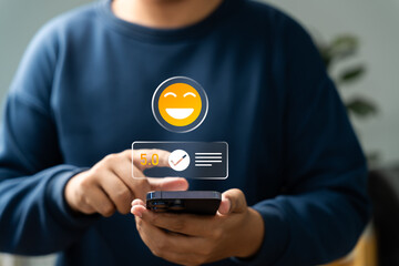 Canvas Print - Customer giving 5-star rating on smartphone screen with smiley emoji icon, symbolizing excellent user feedback, satisfaction review, and positive digital reputation.