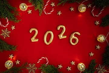 Wall Mural - christmas and happy new year 2026 with gold glitter decorations on red bright background. holiday pa