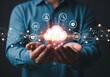 © Jeneeni - Businessman holding a cloud with digital icons and network connections, representing cloud computing and data transfer