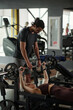 © Clique Images/Stocksy - Young Trainer Spotting Woman During Bench Press