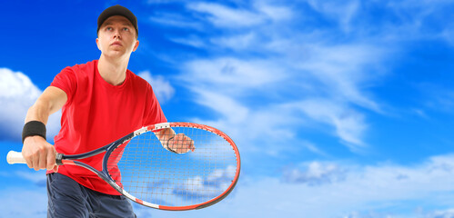 Wall Mural - man playing tennis against blue sky with clouds, low angle view. banner design