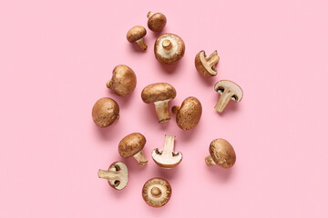 Wall Mural - Fresh raw mushrooms on pink background