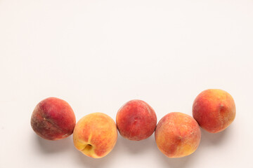 Wall Mural - sweet ripe peaches on beige background
