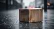 © Farhan - A wet and forgotten cardboard box sits alone on a city sidewalk in the rain, with blurred lights in the background. A concept for lost delivery.