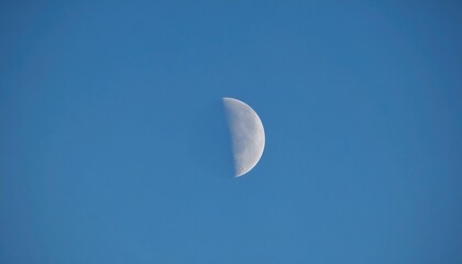 Crescent moon in a clear cerulean sky