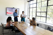 © wavebreak3 - Business team in office presenting award during meeting, smiling and applauding