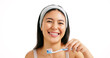 © peopleimages.com - Dental portrait, girl and toothbrush in studio for oral hygiene, mouth cleaning or fresh breath. Mockup space, person or happy with toothpaste on white background for brushing teeth or plaque removal