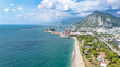 Aerial drone view of Antalya cityscape, Konyaalti beach and cargo port harbor, Antalya holiday vacation resort in Turkey